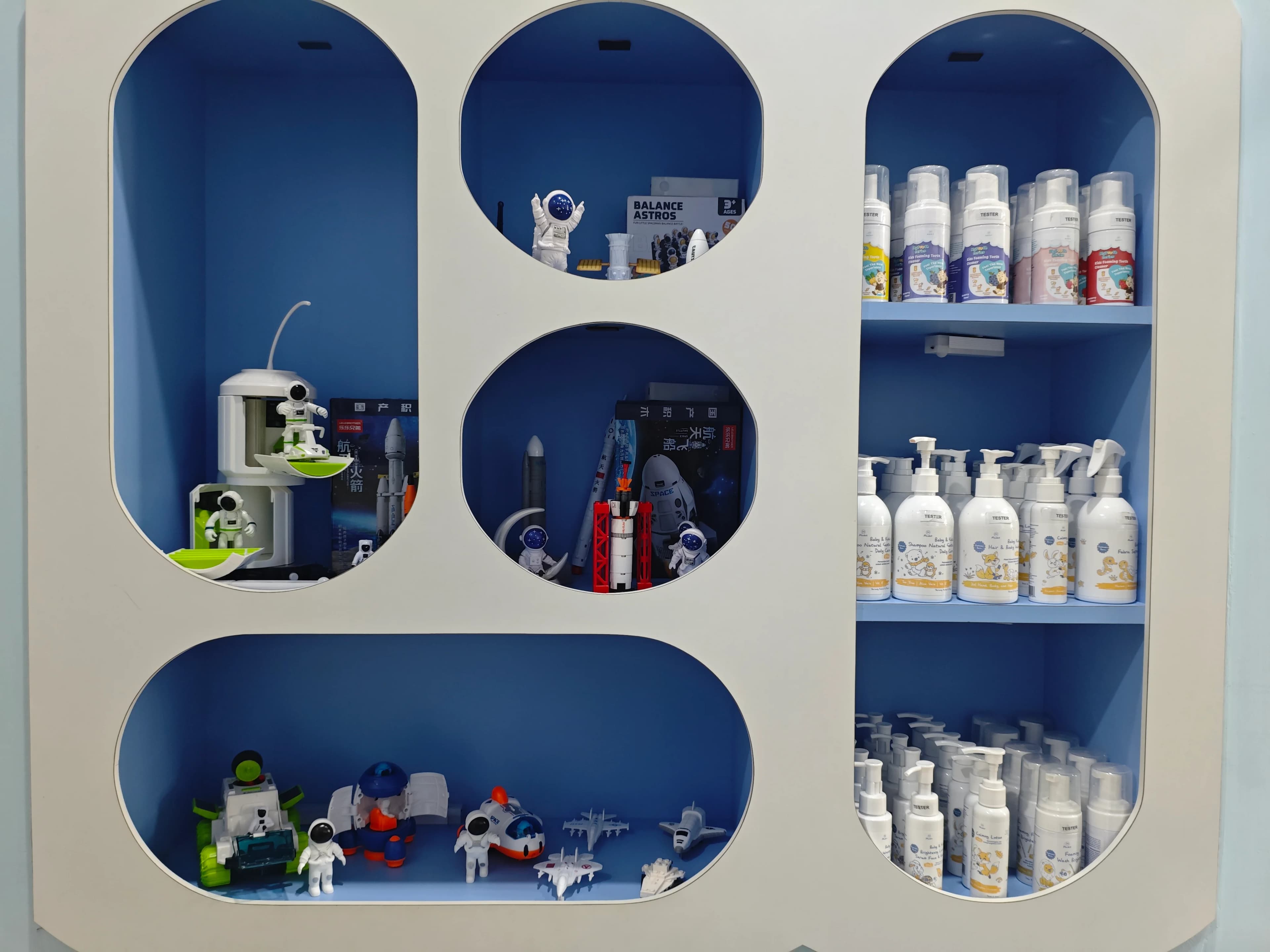 SpaceKids display shelves with dental care products and toys