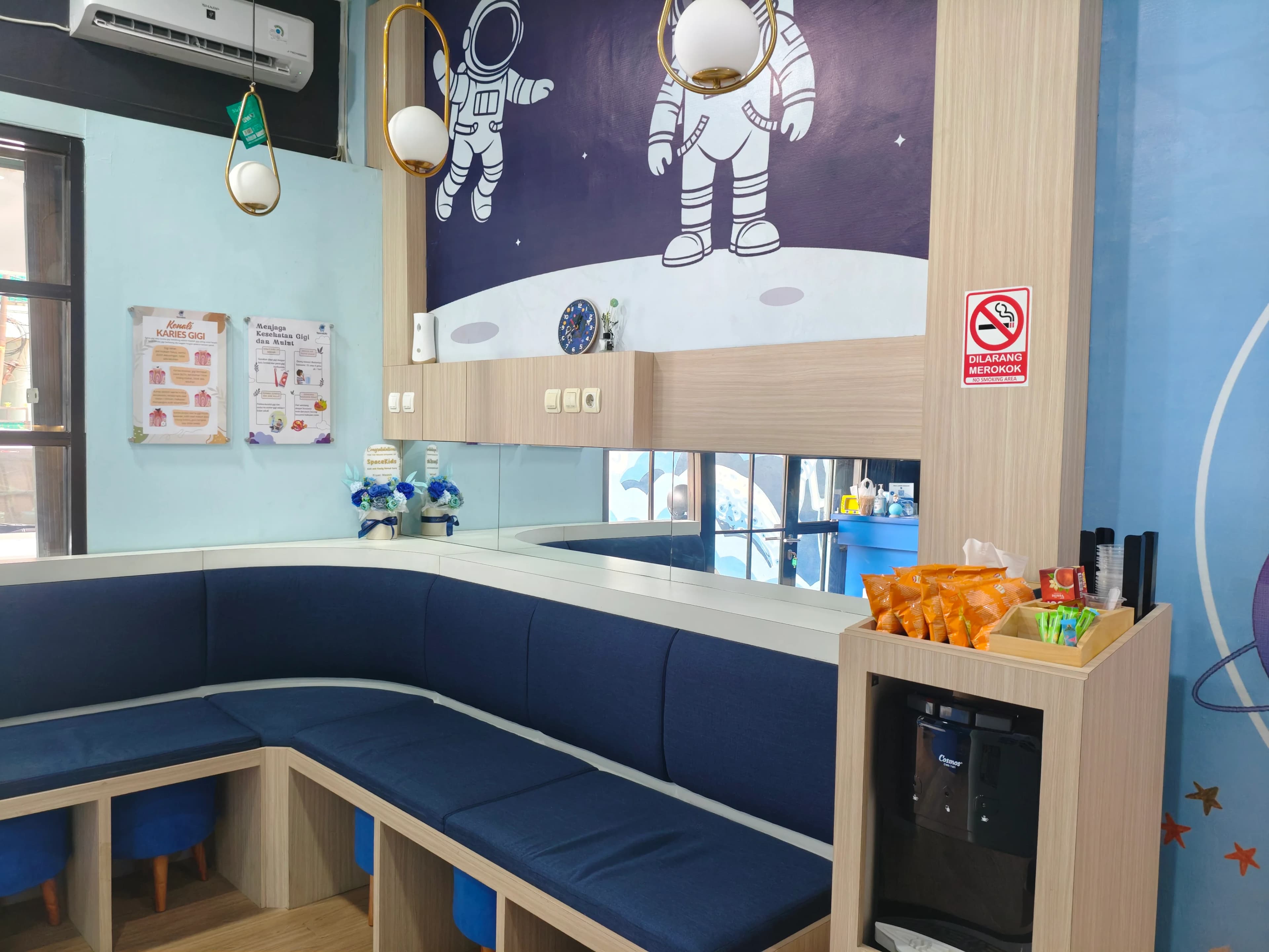 SpaceKids family waiting area with astronaut decor